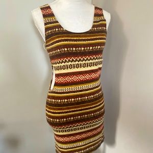 dress with cut outs layered with light material underneath